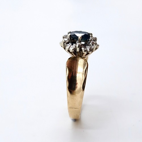 7 - Star lot : A nine carat gold diamond and sapphire stone ring with wide band mount. Size - L. Weight ... 