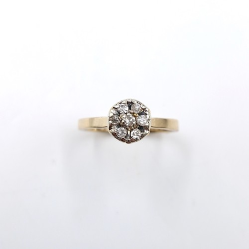 8 - Star lot : A nice example of a diamond flower cluster ring set in nine carat gold. Est. weight of di... 