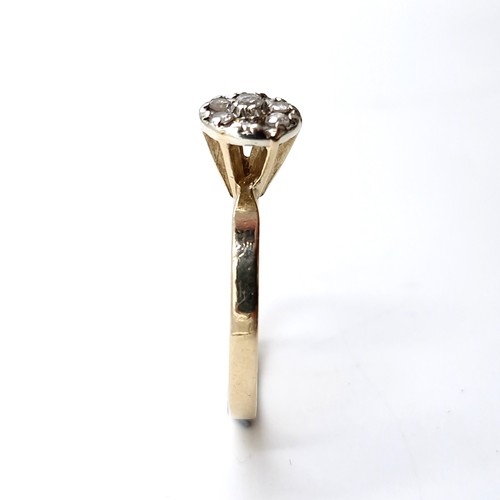 8 - Star lot : A nice example of a diamond flower cluster ring set in nine carat gold. Est. weight of di... 