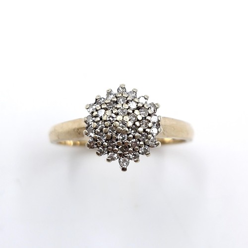 9 - Star lot : A most attractive nine carat gold diamond cluster ring. Est. weight of diamonds is 0.35 c... 