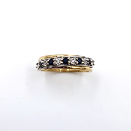 10 - Star lot : A diamond and sapphire half eternity ring set in nine carat gold. Size - M 1/2. Weight - ... 