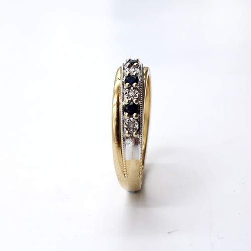 10 - Star lot : A diamond and sapphire half eternity ring set in nine carat gold. Size - M 1/2. Weight - ... 