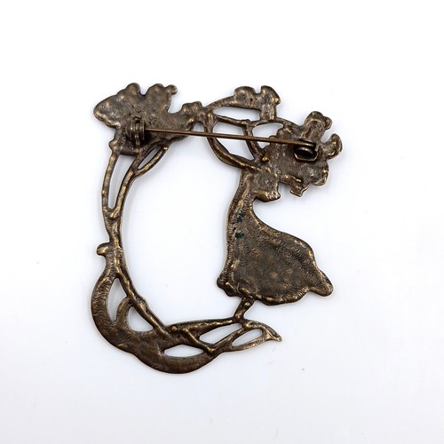 12 - A very nice large  example of an antique Art Nouveau brooch set with a fairy mount and floral decora... 