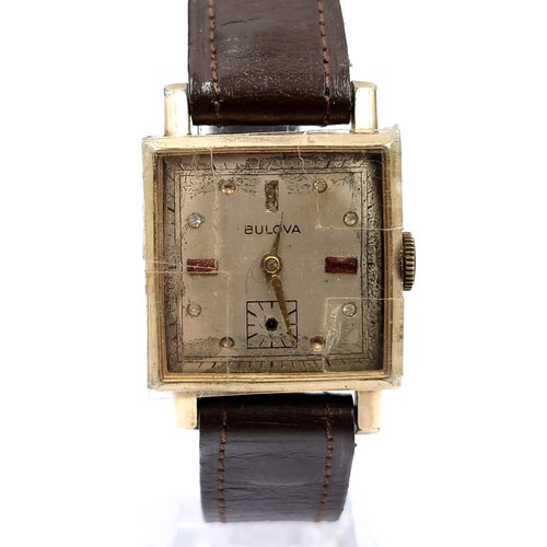 16 - A vintage Bulova wristwatch set with square dial with wind up mechanism and leather strap. Watch in ... 