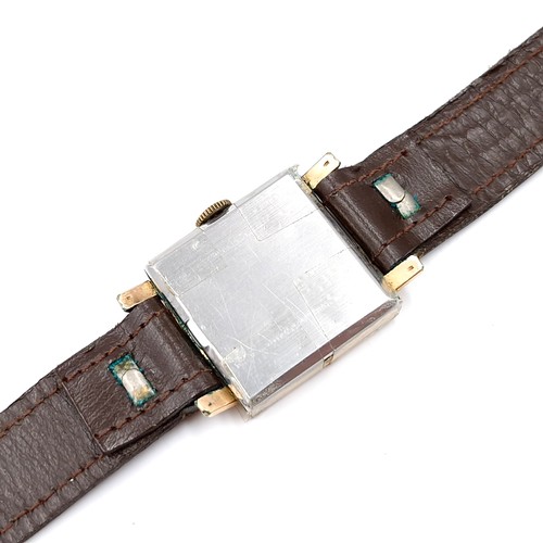 16 - A vintage Bulova wristwatch set with square dial with wind up mechanism and leather strap. Watch in ... 