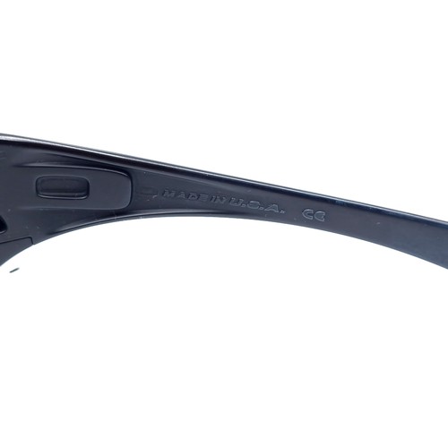 539 - A pair of Oakley Hijinx wrap around sunglasses by Oakley USA marked to frames. Lenses clear.