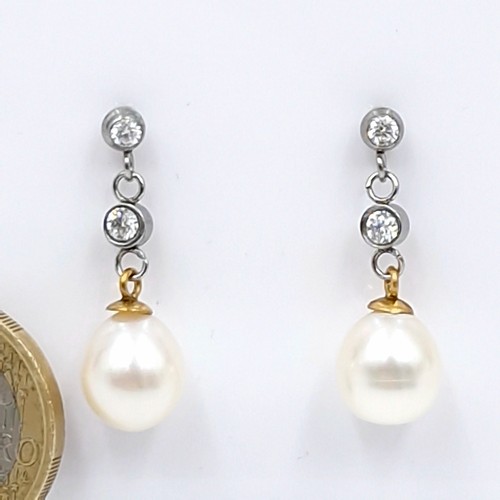 581 - Star lot : A fine pair of brand new pearl diamond stud drop earrings. 0.80cts of diamonds. Those 4 s... 