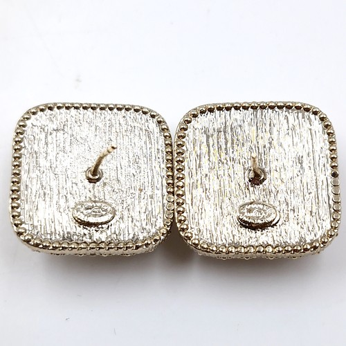 587 - Star Lot : A pair of original brand new designer Chanel gem set stud earrings. Weight - 19.83 grams.