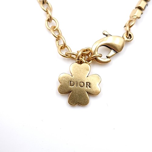 594 - A brand new designer Dior gem set bracelet with Christian Dior charm. Weight - 6.26 grams.