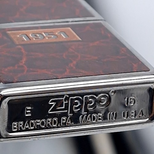 625 - Three excellent examples of genuine Zippo lighters including a planeta leather wrap dating to 1951, ... 