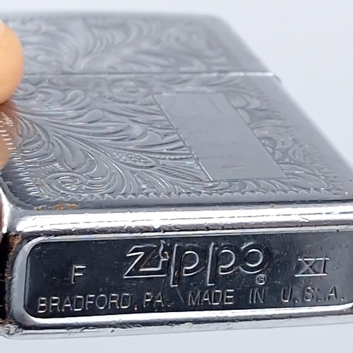 625 - Three excellent examples of genuine Zippo lighters including a planeta leather wrap dating to 1951, ... 