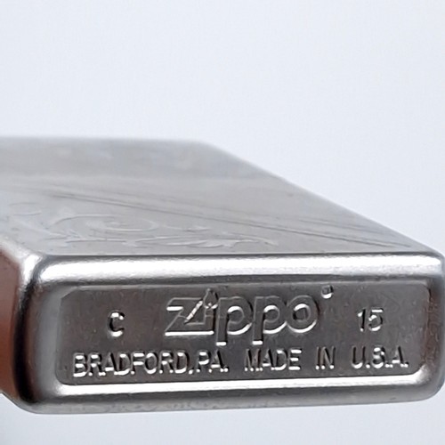 625 - Three excellent examples of genuine Zippo lighters including a planeta leather wrap dating to 1951, ... 