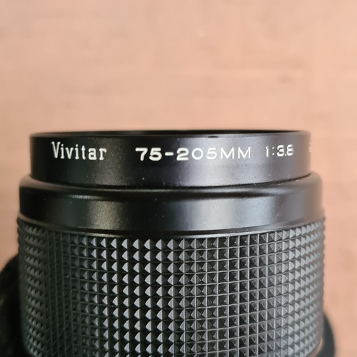 118 - A Vivitar 75-205mm 1:3.8 close focusing auto zoom lens. US$84.95 on Amazon.