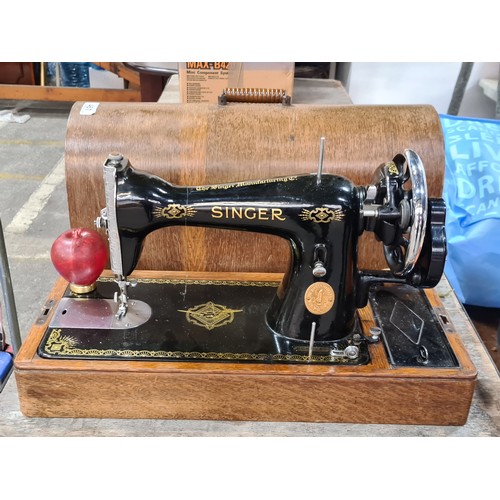 461 - Vintage Singer oak sewing machine with case and handle.