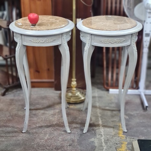 885 - Star Lot : A lovely Pair of French-style  tables have beige marble tops and curved cabriole legs. Th... 