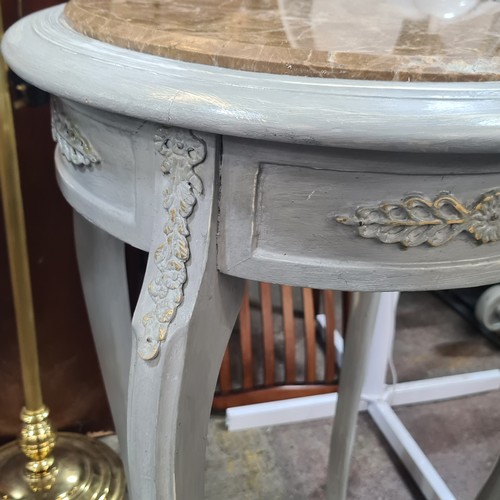 885 - Star Lot : A lovely Pair of French-style  tables have beige marble tops and curved cabriole legs. Th... 