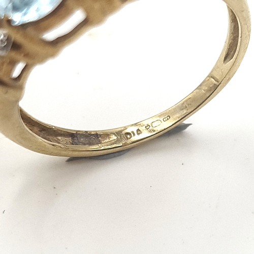 537 - Star Lot : A very nice example of a vintage nine carat gold (375) aquamarine and diamond ring. Diamo... 