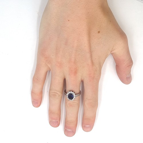 1000 - Star Lot : A very pretty 14 carat white gold gemstone ring. Ring size T. Total weight 4.20 grams. St... 