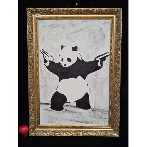 104 - A large spray paint stencil graffiti on board painting after Banksy's 'The Pistol Panda.' House in a... 