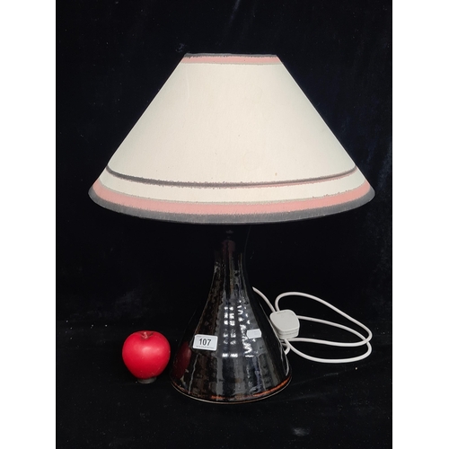 107 - A beautiful Louis Mulcahy studio pottery table lamp with matching oval shade. In good condition with... 