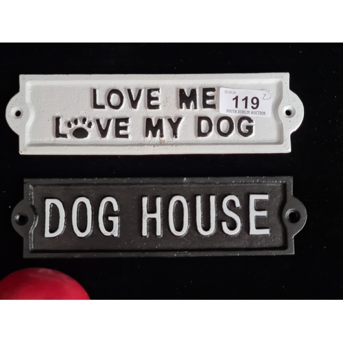 119 - A pair of humorous cast metal wall plaques reading 