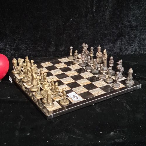 140 - A superb complete marble chess board complete with cast metal 32 pieces. Nice centre piece.