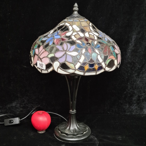 162 - Star Lot  : An elegant Tiffany style table lamp with art nouveau accented base.