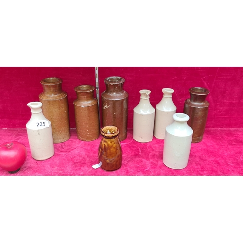 225 - A collection of nine vintage ceramic stoneware ink bottles in varying sizes and glazes. Two slightly... 