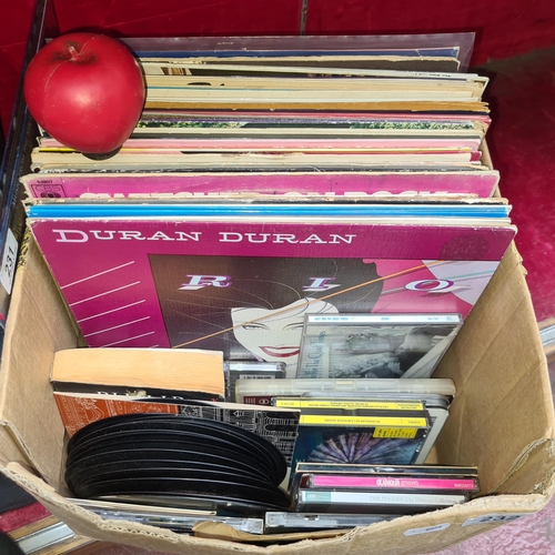 232 - A large collection of vinyl records and CD's from artists such as Duran Duran, Leonard Cohen etc.