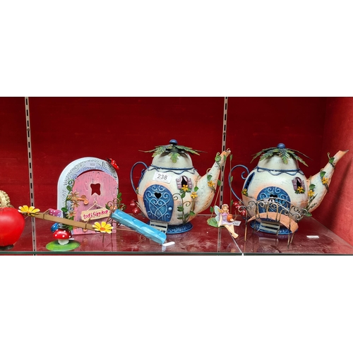 238 - Seven whimsical metal fairy items including two teapot houses, a fairy door and seesaw. Brand new fr... 