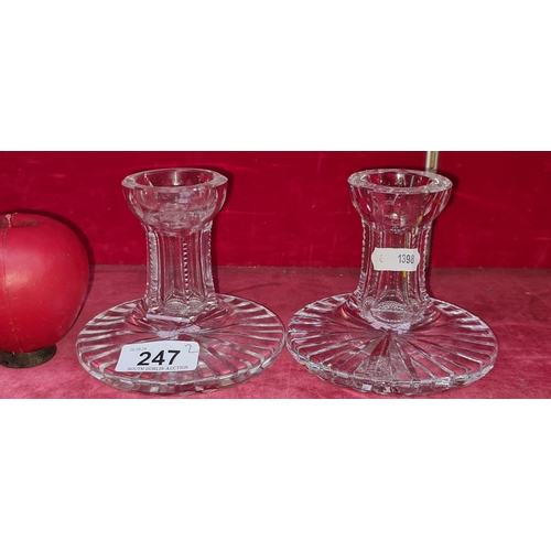 247 - A pair of Waterford Crystal Dinner table candle holders. In good condition with acid marks to base.