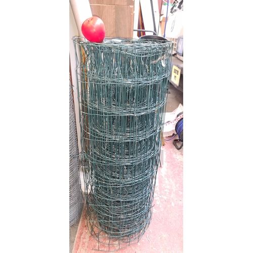 258 - A roll of green coated chicken / sheep wire fencing.