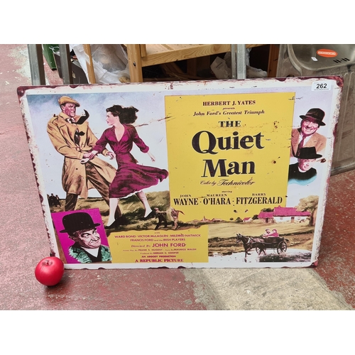 262 - A large printed metal wall sign advertising the film 'The Quiet Man'.