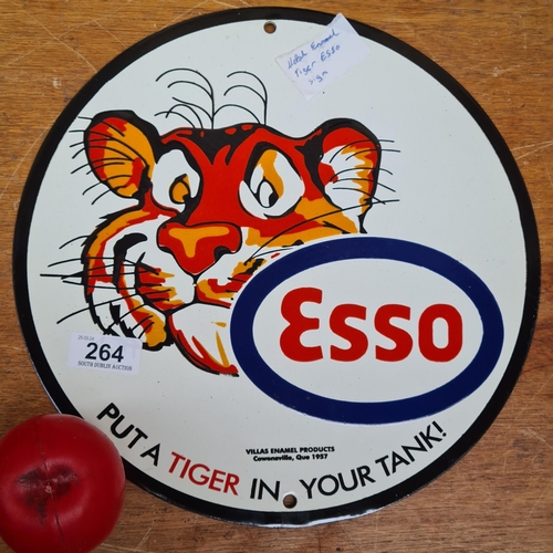 264 - A circular metal heavy enamel advertising sign featuring 'Esso- Put a Tiger in your Taxi'.