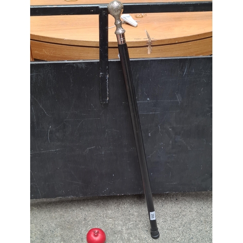 265 - A handsome gentleman's walking stick with engraved steel pommel top.