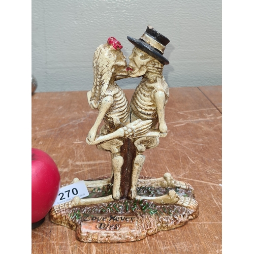 270 - A fantastic Halloween cast metal 'Love Never Dies' figure. Features two embracing skeletons in Cinco... 