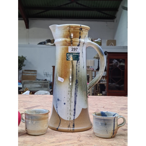 297 - Three eye catching pieces of Kiltrea studio pottery. Comprising of a large water pitcher and two mat... 