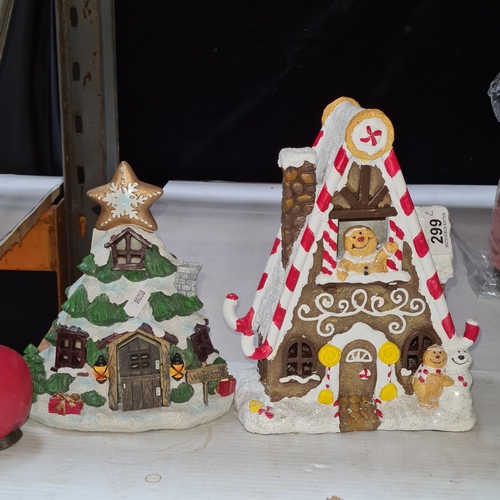 299 - Two fun Christmas decorations including one in the form of a gingerbread house. Brand new from a top... 