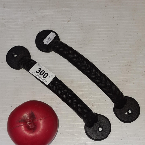 300 - A heavy pair of cast iron twist door handles. Brand new from a top Uk design company.