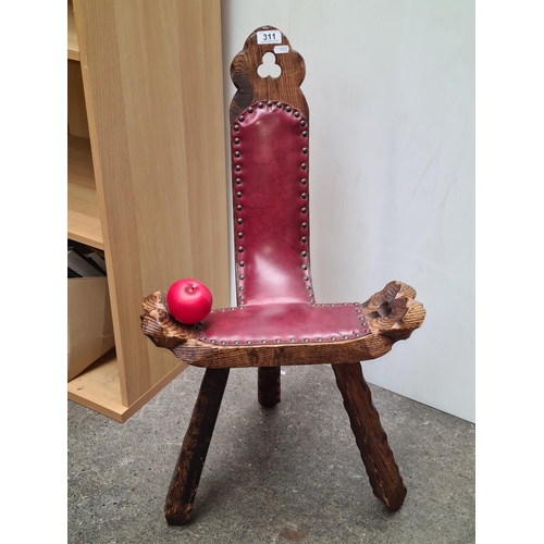 311 - A wonderful vintage birthing stool with oxblood leather seat and brass studs.