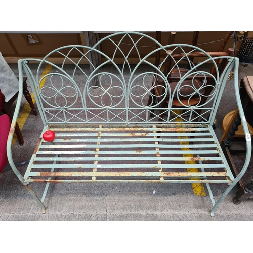 331 - A vintage, very elegant cast iron two seater garden bench with pierced decoration to frame. Really n... 