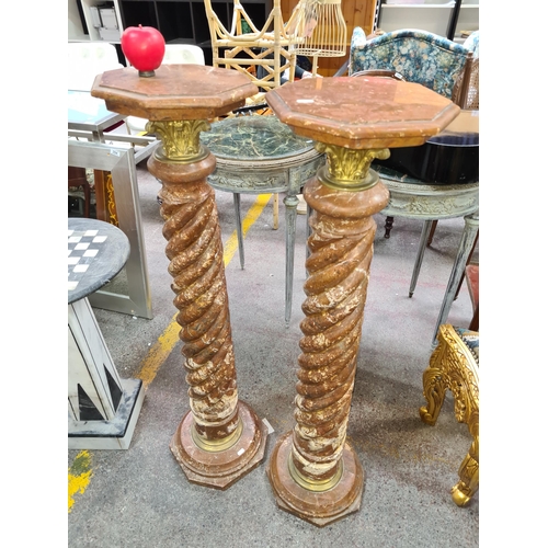 366 - Star Lot A pair of cold Italian marble and gilt brass columns each featuring an octagonal top, Twist... 