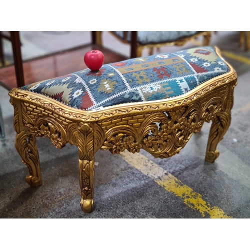 367 - A stunning luxury gilt baroque stool featuring pierced floral motifs to frame along with studded det... 