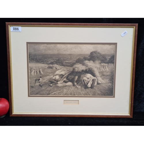 86 - A vintage print of a John Linnell painting titled 'Noonday Rest.' House in a wood and gilt frame beh... 