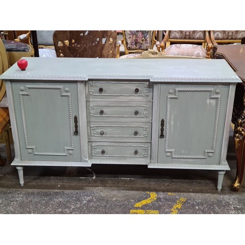 388 - Star Lot : An impressive large French Louis XV sideboard featuring a cupboard to either side, along ... 