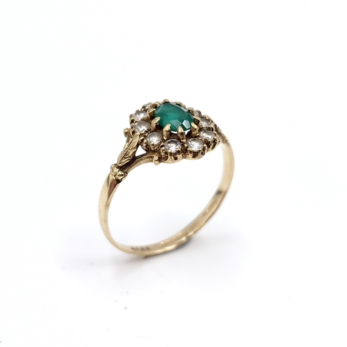 11 - An emerald gem set ring set in nine carat gold (375). Ring size - N. Weight - 1.69 grams.