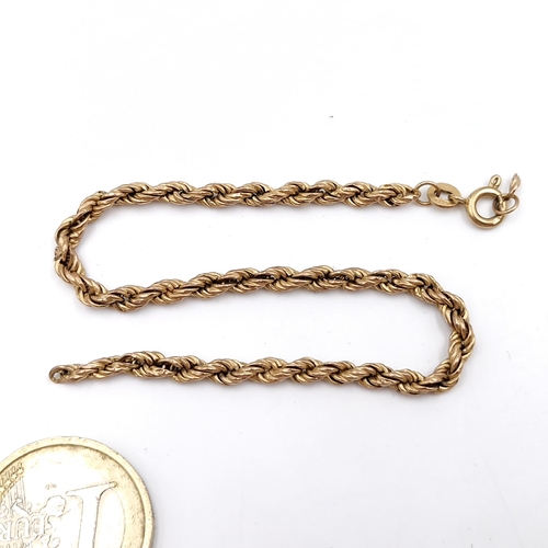 14 - A nine carat gold (375) twist link bracelet. Weight - 2.47 grams. Need repair