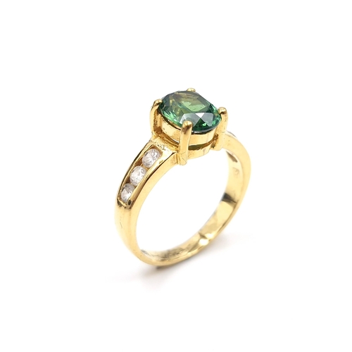 2 - Star Lot : A green gemstone ring set with gem set shoulders - ring marked 18k to band. Ring size - K... 