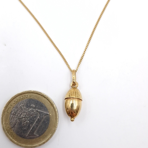 21 - Star Lot : A pretty 18ct gold pendant and chain marked 750 necklace. Pendant in the form acorn. Leng... 