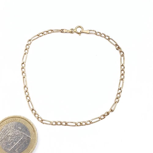 23 - A nine carat gold Figaro chain bracelet. Weight - 0.7 grams.